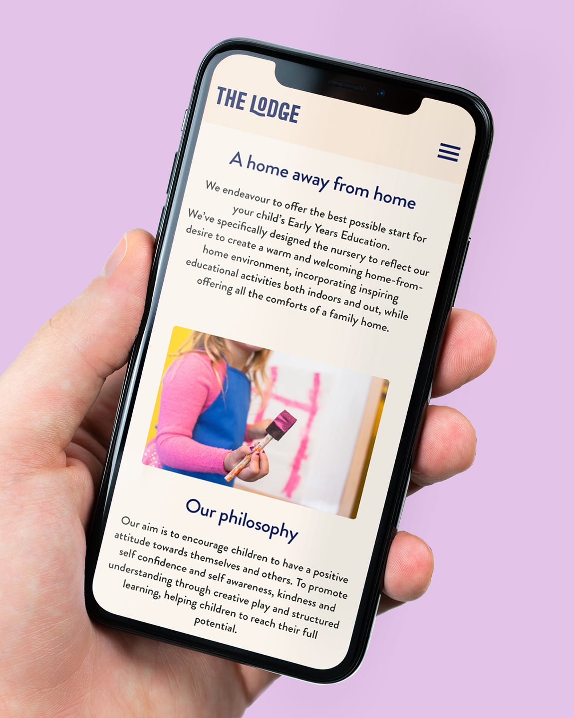 The Lodge website - iPhone mockup in hand